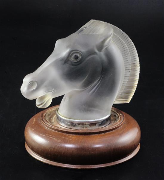 Longchamp/Horse. A glass mascot by René Lalique, introduced on 12/6/1929, No.1152A Height 12cm, overall 15cm.